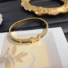 Hermès Clic H Bracelet (Logo Band) Gold-Tone