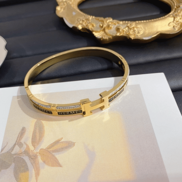 Hermès Clic H Bracelet (Logo Band) Gold-Tone