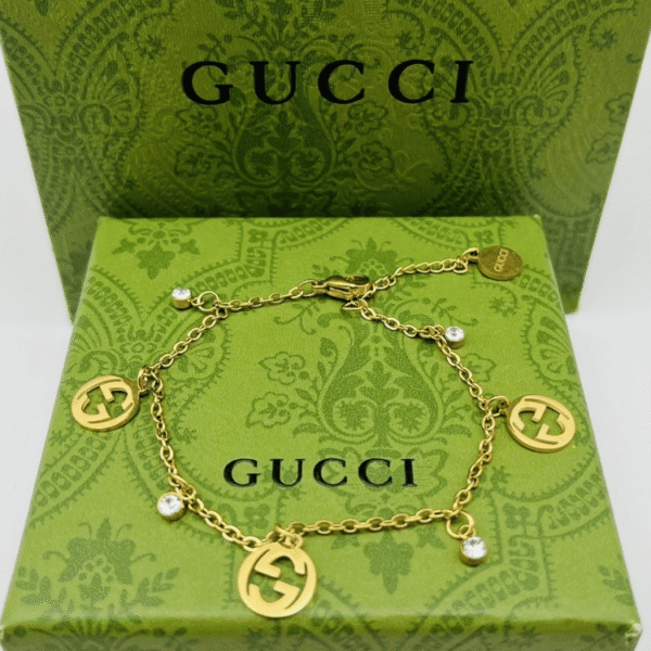 1-502.png Gucci Interlocking G Charm Bracelet With Rhinestones Gold-Tone