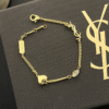 1-506.png Yves Saint Laurent Cassandre Logo And Heart Charm Bracelet Gold-Tone