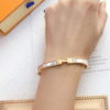 Hermès Clic H Bracelet White Enamel Gold-Tone