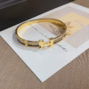Hermès Clic H Bracelet (Logo Band) Gold-Tone