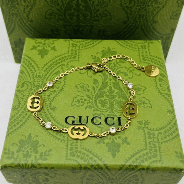 2-499.png Gucci Interlocking G Charm Bracelet With Rhinestones Gold-Tone
