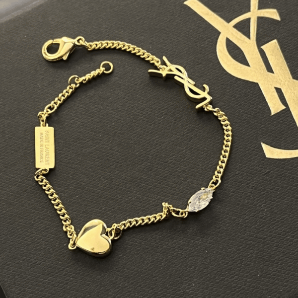 3-490.png Yves Saint Laurent Cassandre Logo And Heart Charm Bracelet Gold-Tone