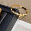 Hermès Clic H Bracelet (Logo Band) Gold-Tone