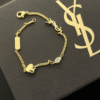 4-487.png Yves Saint Laurent Cassandre Logo And Heart Charm Bracelet Gold-Tone