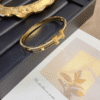 Hermès Clic H Bracelet (Logo Band) Gold-Tone