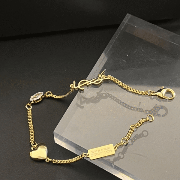 5-468.png Yves Saint Laurent Cassandre Logo And Heart Charm Bracelet Gold-Tone