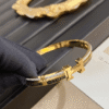 Hermès Clic H Bracelet (Logo Band) Gold-Tone