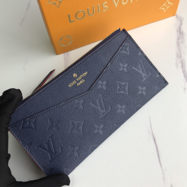 Louis Vuitton Pochette Melanie Monogram Empreinte Navy Blue 9 Inches M68712